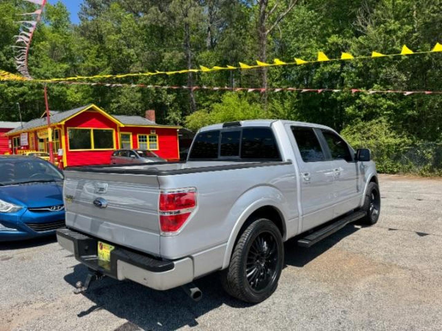 2014 Silver Ford F-150 LARIAT (1FTFW1CT0EK) with an 3.5L V6 TURBO engine, 6-Speed Automatic transmission, located at 1806 Veterans Memorial Hwy SW, Austell, GA, 30168, (770) 944-9558, 33.817959, -84.606987 - Photo#3