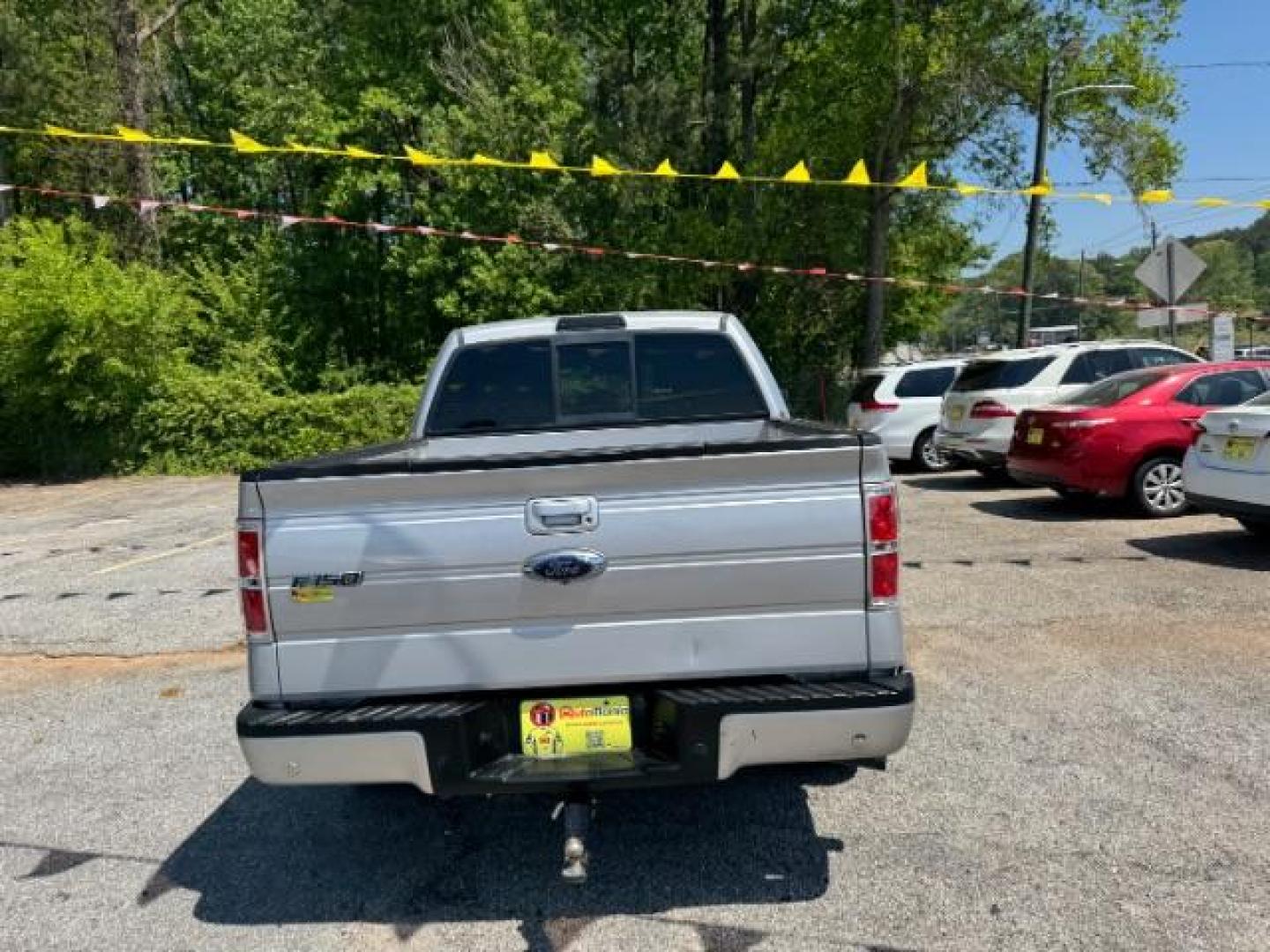2014 Silver Ford F-150 LARIAT (1FTFW1CT0EK) with an 3.5L V6 TURBO engine, 6-Speed Automatic transmission, located at 1806 Veterans Memorial Hwy SW, Austell, GA, 30168, (770) 944-9558, 33.817959, -84.606987 - Photo#4
