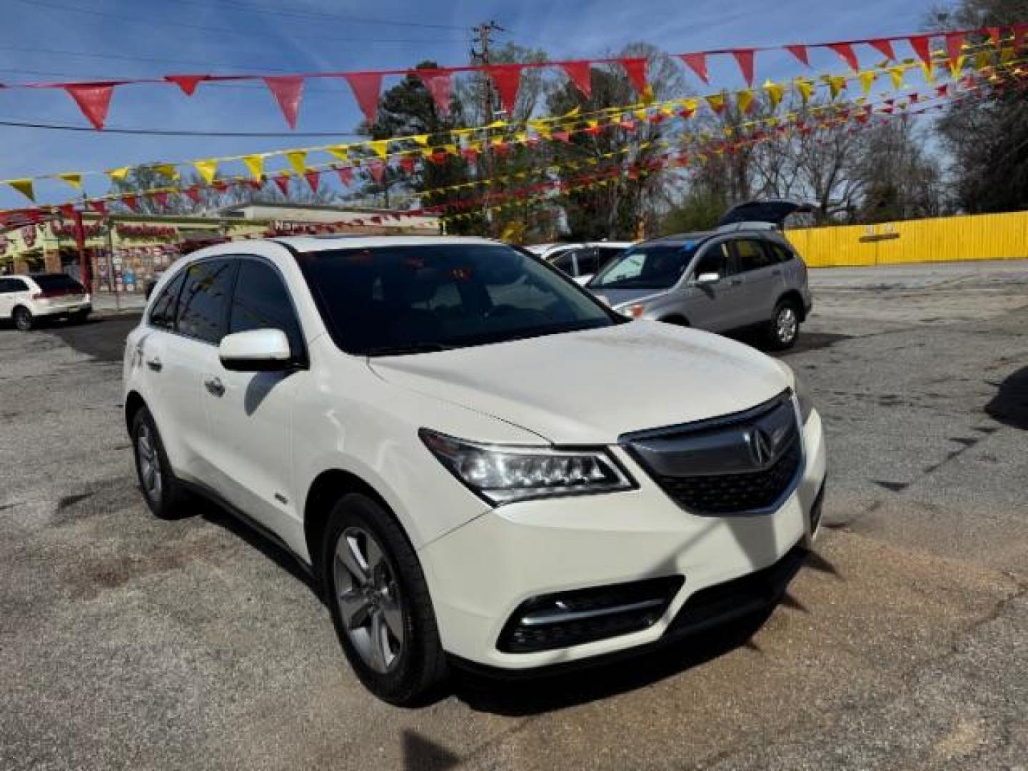2014 White Acura MDX 6-Spd AT (5FRYD3H22EB) with an 3.5L V6 SOHC 24V engine, 6-Speed Automatic transmission, located at 1806 Veterans Memorial Hwy SW, Austell, GA, 30168, (770) 944-9558, 33.817959, -84.606987 - Photo#2