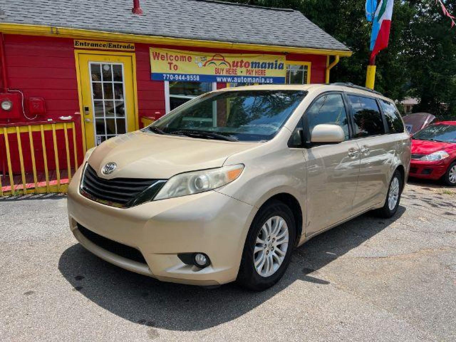 2011 Gold Toyota Sienna XLE 8-Pass V6 (5TDYK3DC9BS) with an 3.5L V6 EFI DOHC 24V engine, 5-Speed Automatic transmission, located at 1806 Veterans Memorial Hwy SW, Austell, GA, 30168, (770) 944-9558, 33.817959, -84.606987 - Photo #0