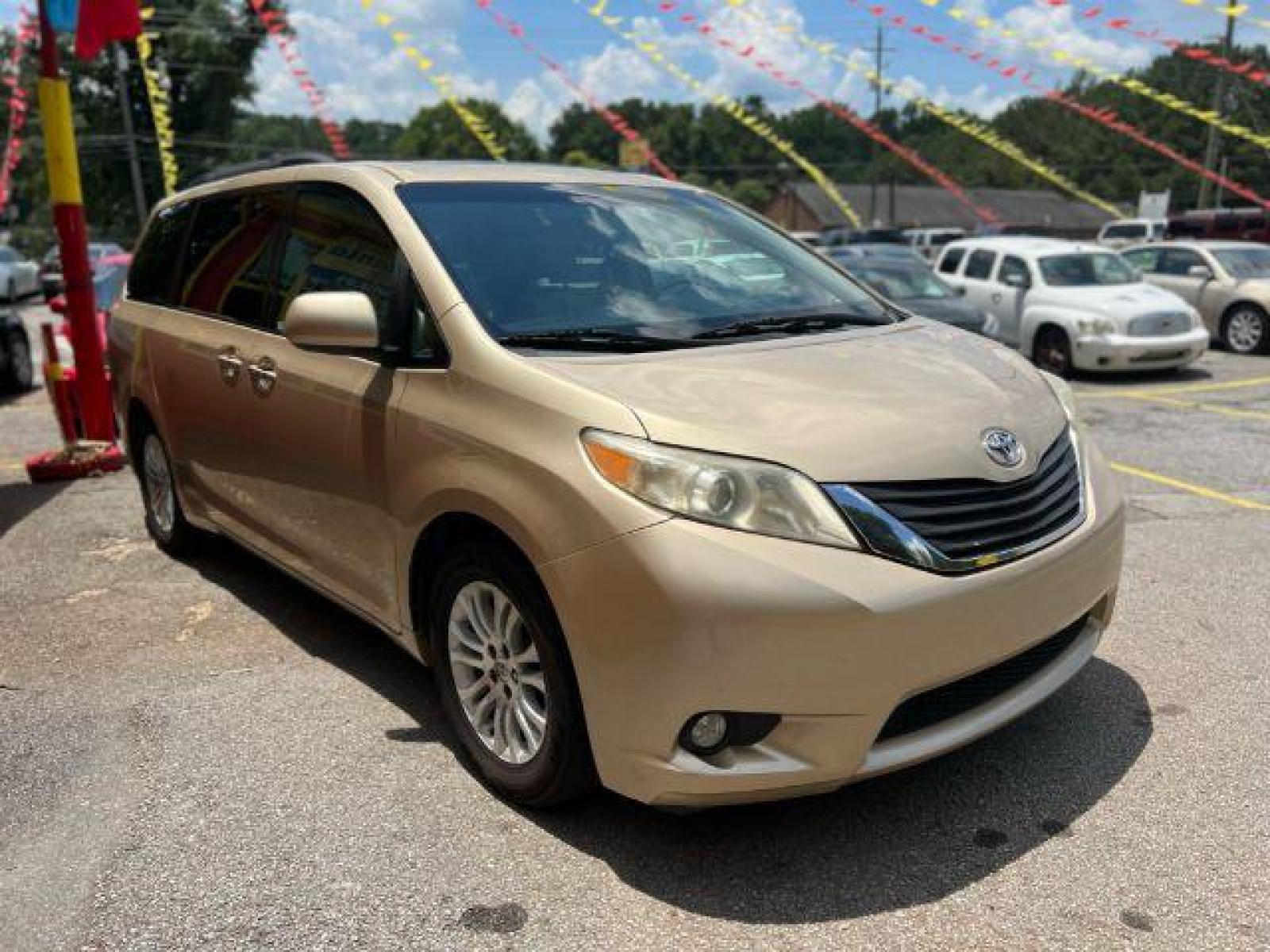 2011 Gold Toyota Sienna XLE 8-Pass V6 (5TDYK3DC9BS) with an 3.5L V6 EFI DOHC 24V engine, 5-Speed Automatic transmission, located at 1806 Veterans Memorial Hwy SW, Austell, GA, 30168, (770) 944-9558, 33.817959, -84.606987 - Photo #2