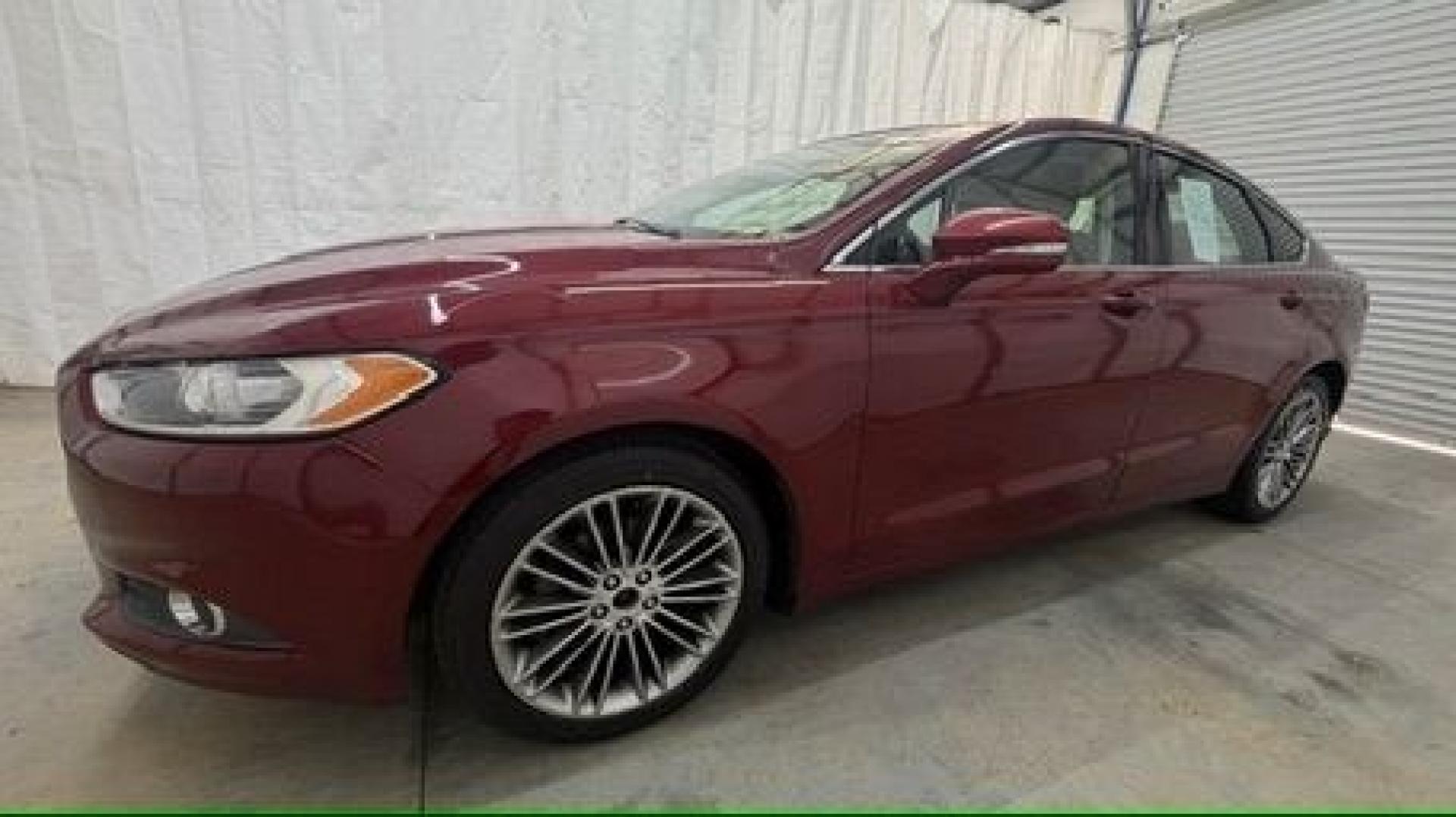 2013 Red Ford Fusion SE (3FA6P0H95DR) with an 2.0L L4 DOHC 16V engine, located at 1806 Veterans Memorial Hwy SW, Austell, GA, 30168, (770) 944-9558, 33.817959, -84.606987- Photo#1