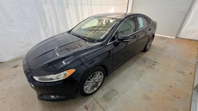 2013 Black Ford Fusion SE (3FA6P0HR9DR) with an 1.6L L4 DOHC 16V engine, located at 1806 Veterans Memorial Hwy SW, Austell, GA, 30168, (770) 944-9558, 33.817959, -84.606987 - Photo#1