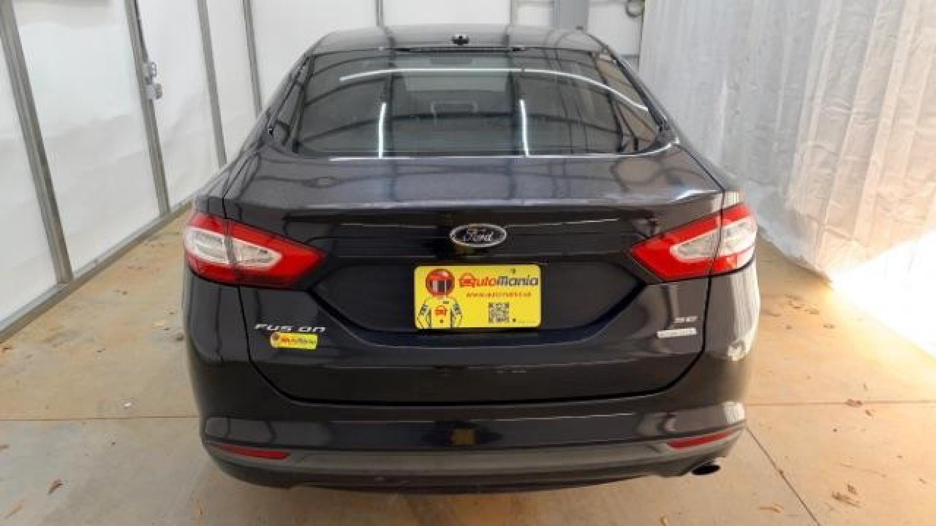 2013 Black Ford Fusion SE (3FA6P0HR9DR) with an 1.6L L4 DOHC 16V engine, located at 1806 Veterans Memorial Hwy SW, Austell, GA, 30168, (770) 944-9558, 33.817959, -84.606987 - Photo#4