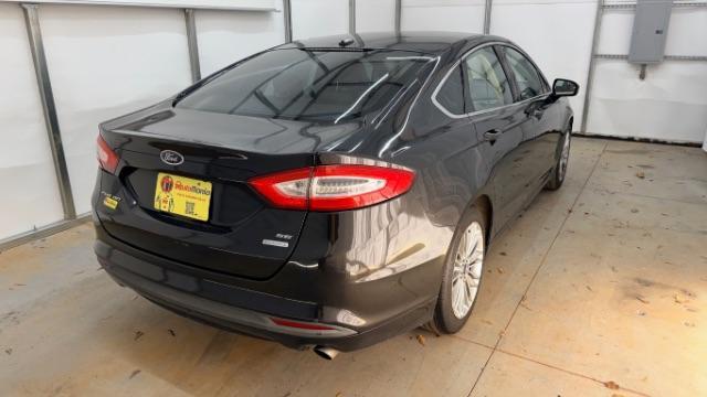 2013 Black Ford Fusion SE (3FA6P0HR9DR) with an 1.6L L4 DOHC 16V engine, located at 1806 Veterans Memorial Hwy SW, Austell, GA, 30168, (770) 944-9558, 33.817959, -84.606987 - Photo#5