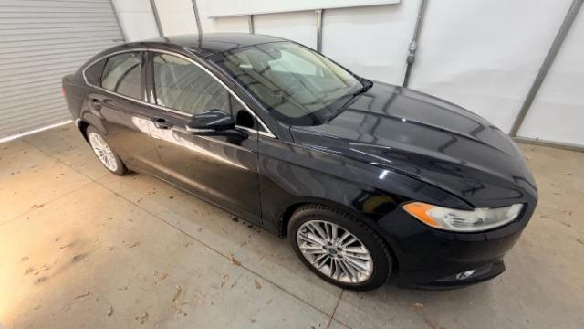2013 Black Ford Fusion SE (3FA6P0HR9DR) with an 1.6L L4 DOHC 16V engine, located at 1806 Veterans Memorial Hwy SW, Austell, GA, 30168, (770) 944-9558, 33.817959, -84.606987 - Photo#7