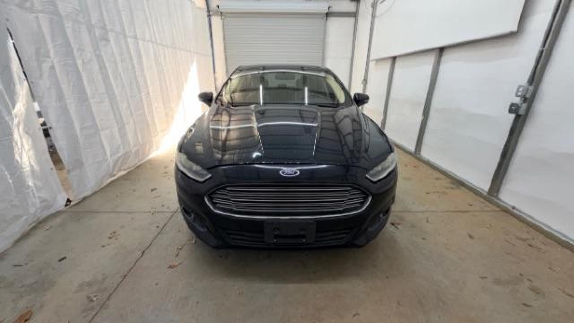 2013 Black Ford Fusion SE (3FA6P0HR9DR) with an 1.6L L4 DOHC 16V engine, located at 1806 Veterans Memorial Hwy SW, Austell, GA, 30168, (770) 944-9558, 33.817959, -84.606987 - Photo#9