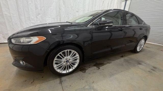 2013 Black Ford Fusion SE (3FA6P0HR9DR) with an 1.6L L4 DOHC 16V engine, located at 1806 Veterans Memorial Hwy SW, Austell, GA, 30168, (770) 944-9558, 33.817959, -84.606987 - Photo#1