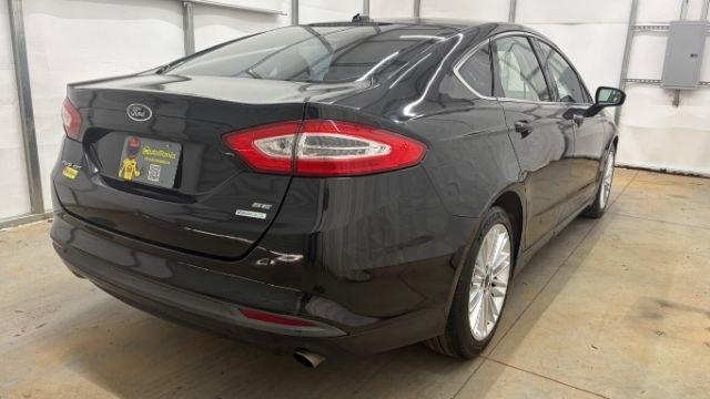 2013 Black Ford Fusion SE (3FA6P0HR9DR) with an 1.6L L4 DOHC 16V engine, located at 1806 Veterans Memorial Hwy SW, Austell, GA, 30168, (770) 944-9558, 33.817959, -84.606987 - Photo#4