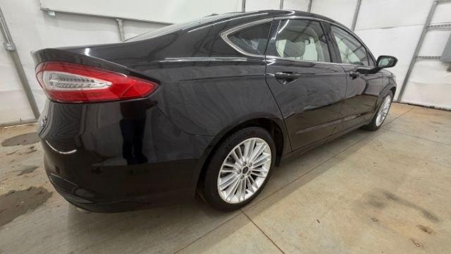 2013 Black Ford Fusion SE (3FA6P0HR9DR) with an 1.6L L4 DOHC 16V engine, located at 1806 Veterans Memorial Hwy SW, Austell, GA, 30168, (770) 944-9558, 33.817959, -84.606987 - Photo#5