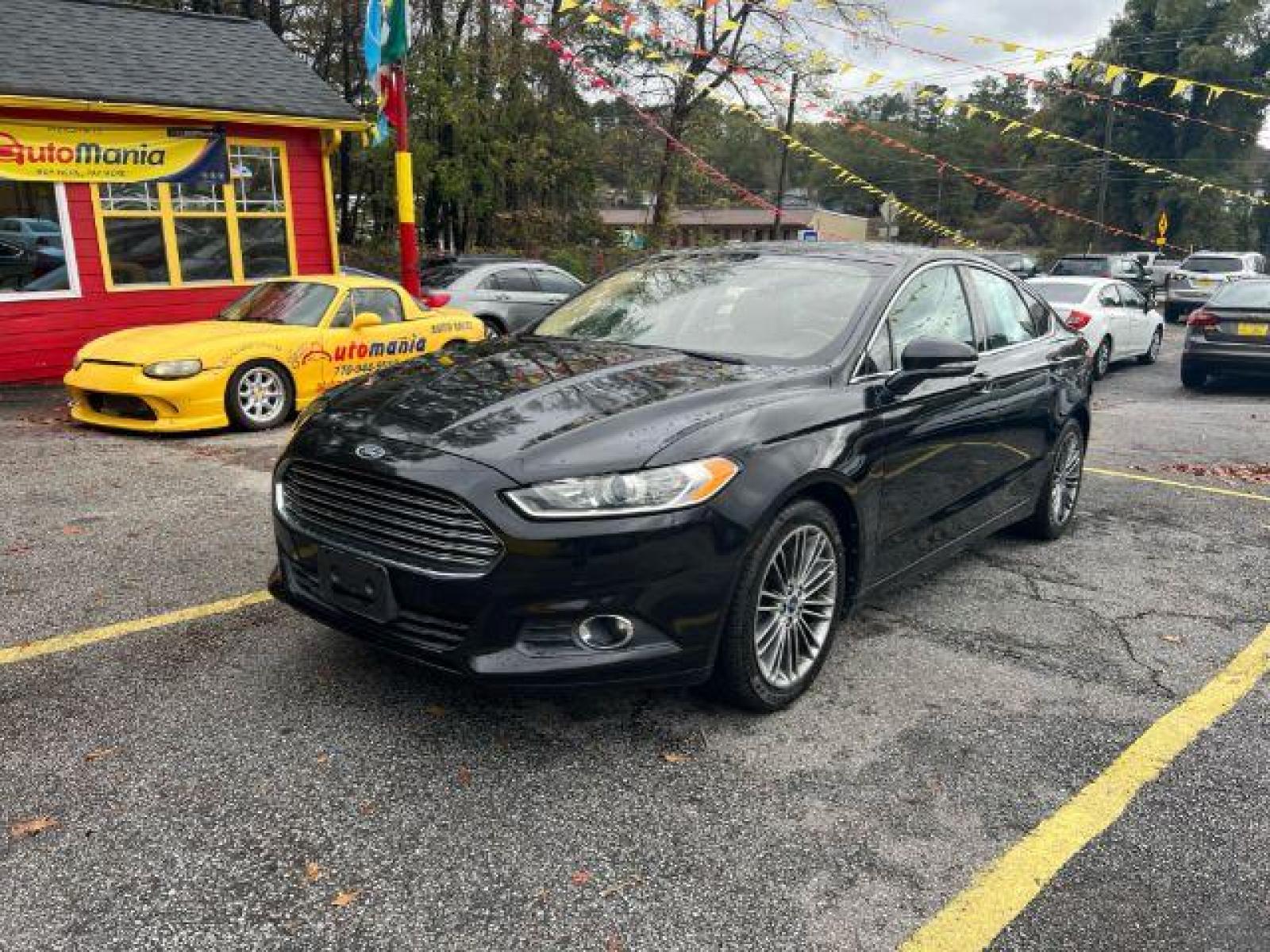 2013 Black Ford Fusion SE (3FA6P0HR9DR) with an 1.6L L4 DOHC 16V engine, located at 1806 Veterans Memorial Hwy SW, Austell, GA, 30168, (770) 944-9558, 33.817959, -84.606987 - Photo #0