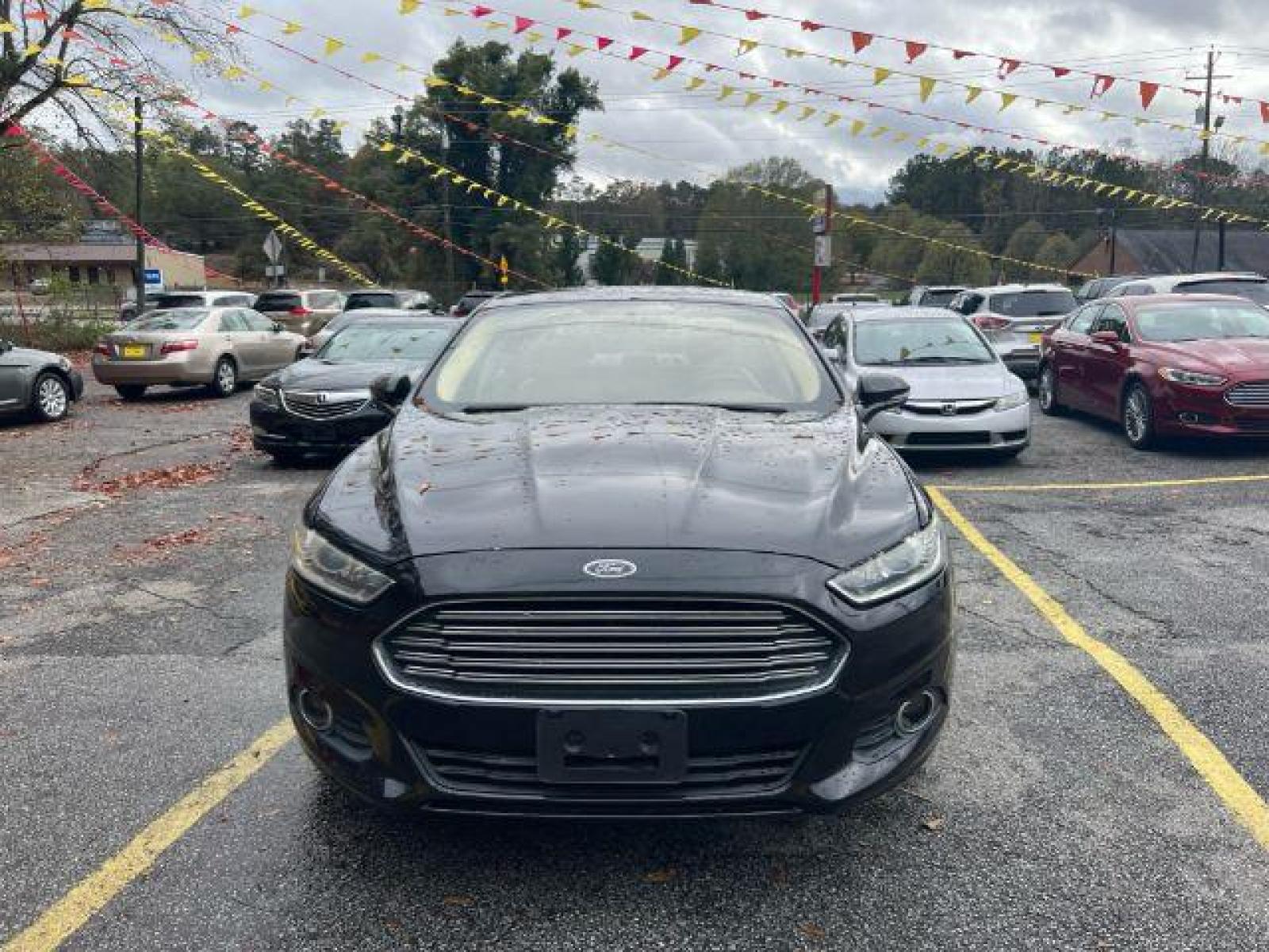2013 Black Ford Fusion SE (3FA6P0HR9DR) with an 1.6L L4 DOHC 16V engine, located at 1806 Veterans Memorial Hwy SW, Austell, GA, 30168, (770) 944-9558, 33.817959, -84.606987 - Photo #1