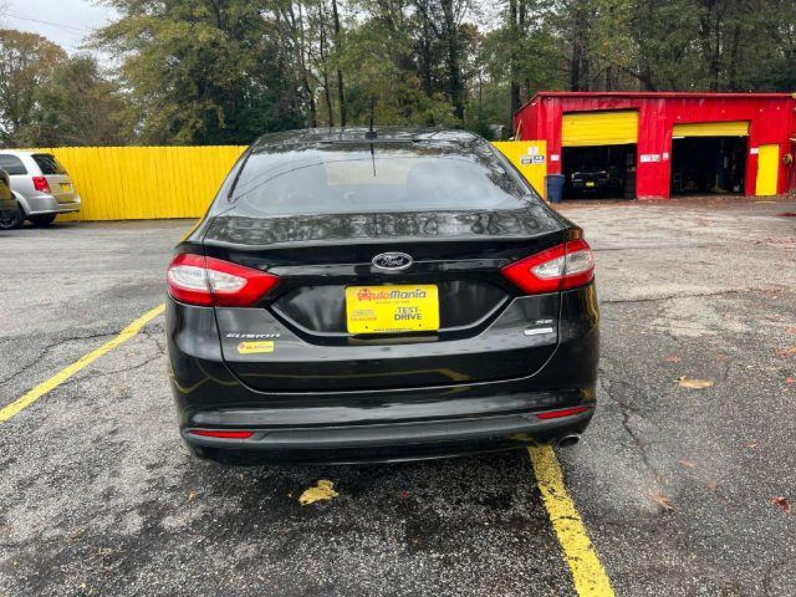 2013 Black Ford Fusion SE (3FA6P0HR9DR) with an 1.6L L4 DOHC 16V engine, located at 1806 Veterans Memorial Hwy SW, Austell, GA, 30168, (770) 944-9558, 33.817959, -84.606987 - Photo #6