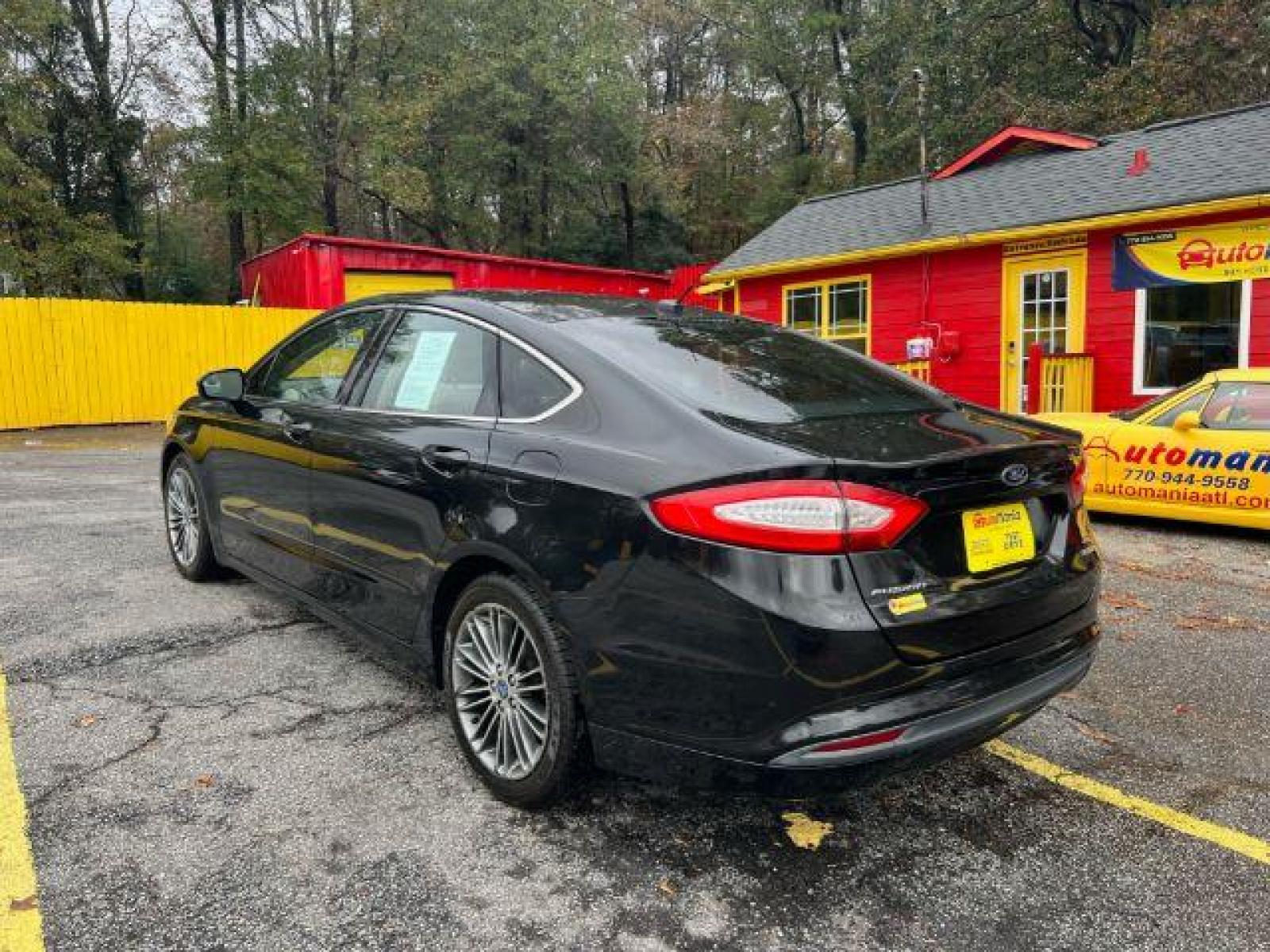 2013 Black Ford Fusion SE (3FA6P0HR9DR) with an 1.6L L4 DOHC 16V engine, located at 1806 Veterans Memorial Hwy SW, Austell, GA, 30168, (770) 944-9558, 33.817959, -84.606987 - Photo #7