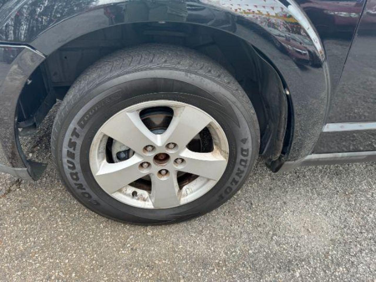 2012 black Dodge Journey SXT (3C4PDCBG1CT) with an 3.6L V6 DOHC 24V engine, 6-Speed Automatic transmission, located at 1806 Veterans Memorial Hwy SW, Austell, GA, 30168, (770) 944-9558, 33.817959, -84.606987 - Photo#18