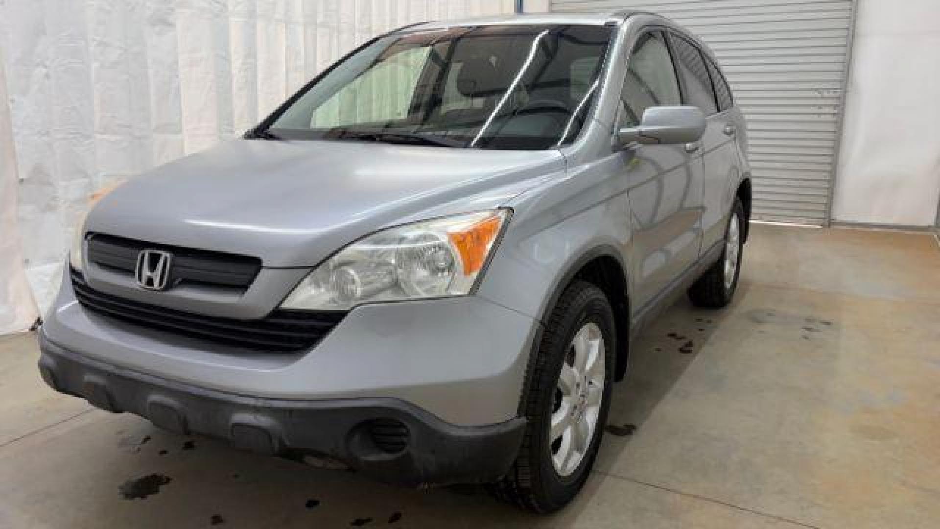 2008 Silver Honda CR-V EX-L 2WD AT (JHLRE38788C) with an 2.4L L4 DOHC 16V engine, 5-Speed Automatic transmission, located at 1806 Veterans Memorial Hwy SW, Austell, GA, 30168, (770) 944-9558, 33.817959, -84.606987 - Photo#0