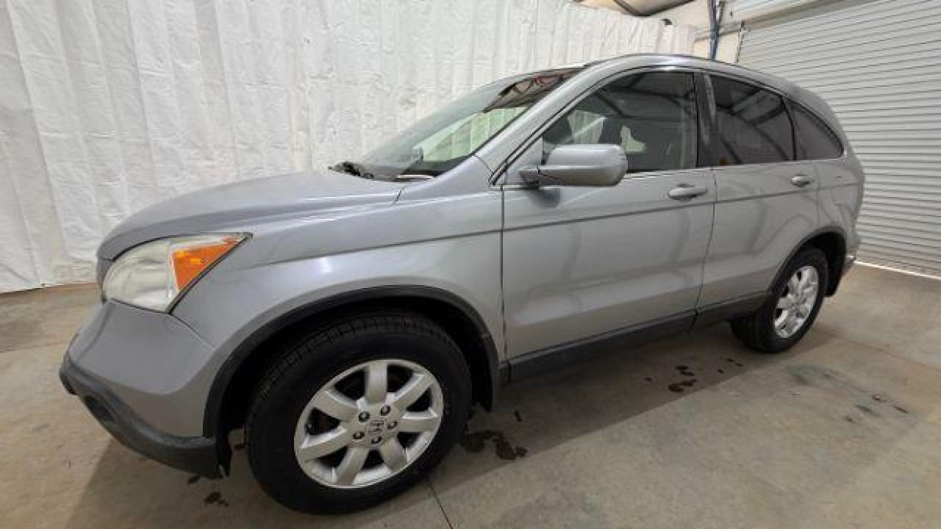 2008 Silver Honda CR-V EX-L 2WD AT (JHLRE38788C) with an 2.4L L4 DOHC 16V engine, 5-Speed Automatic transmission, located at 1806 Veterans Memorial Hwy SW, Austell, GA, 30168, (770) 944-9558, 33.817959, -84.606987 - Photo#1