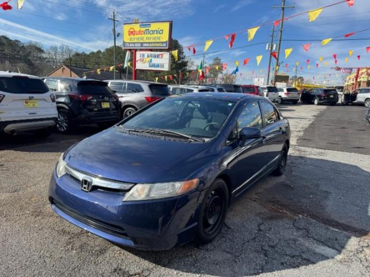 2007 Blue Honda Civic LX Sedan AT (1HGFA16527L) with an 1.8L L4 SOHC 16V engine, 5-Speed Automatic transmission, located at 1806 Veterans Memorial Hwy SW, Austell, GA, 30168, (770) 944-9558, 33.817959, -84.606987 - Photo#0