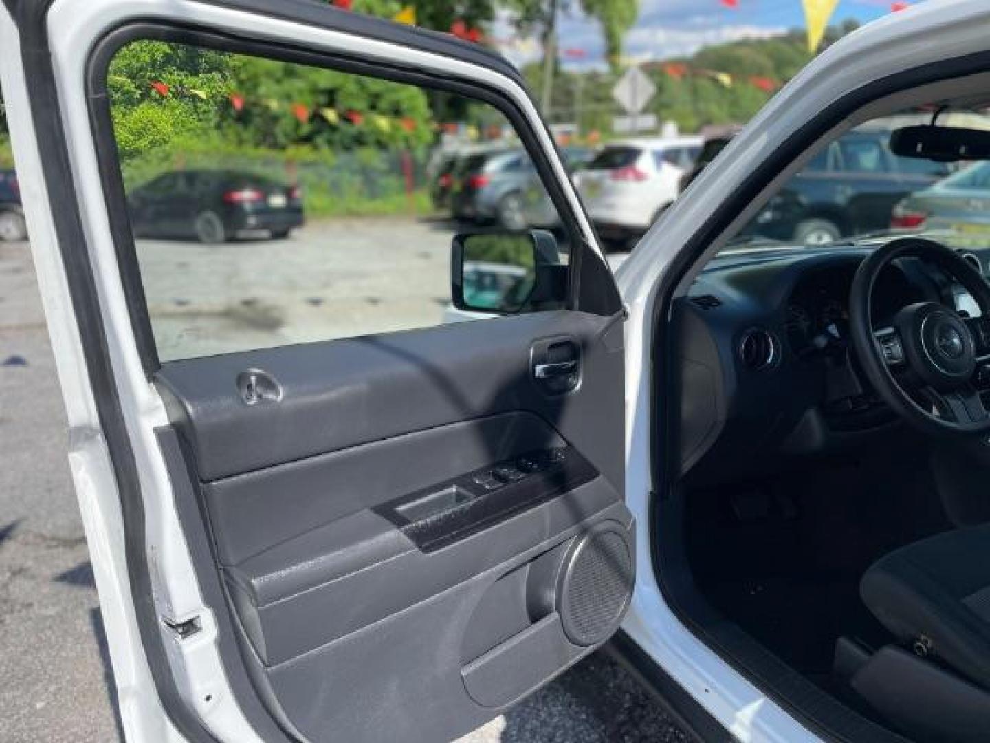 2014 White Jeep Patriot Sport 2WD (1C4NJPBAXED) with an 2.0L L4 DOHC 16V engine, Continuously Variable Transmission transmission, located at 1806 Veterans Memorial Hwy SW, Austell, GA, 30168, (770) 944-9558, 33.817959, -84.606987 - Photo#11