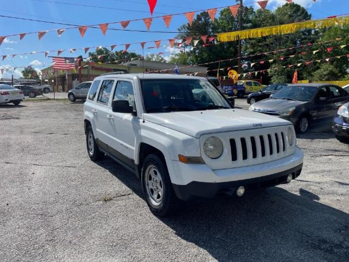 2014 White Jeep Patriot Sport 2WD (1C4NJPBAXED) with an 2.0L L4 DOHC 16V engine, Continuously Variable Transmission transmission, located at 1806 Veterans Memorial Hwy SW, Austell, GA, 30168, (770) 944-9558, 33.817959, -84.606987 - Photo#2