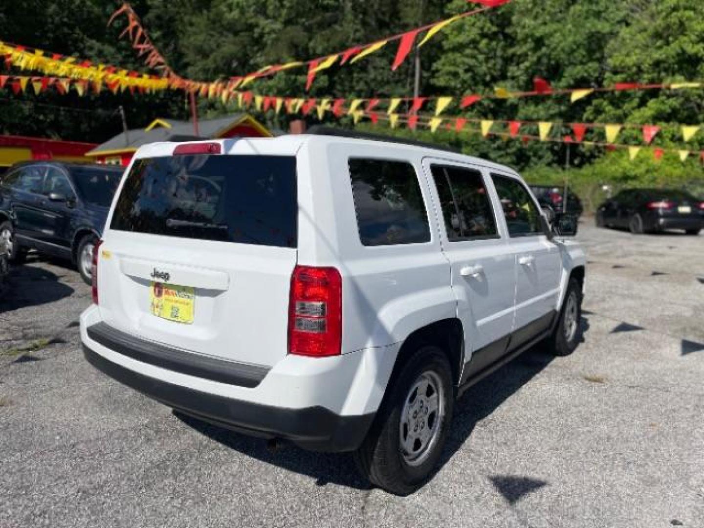 2014 White Jeep Patriot Sport 2WD (1C4NJPBAXED) with an 2.0L L4 DOHC 16V engine, Continuously Variable Transmission transmission, located at 1806 Veterans Memorial Hwy SW, Austell, GA, 30168, (770) 944-9558, 33.817959, -84.606987 - Photo#20