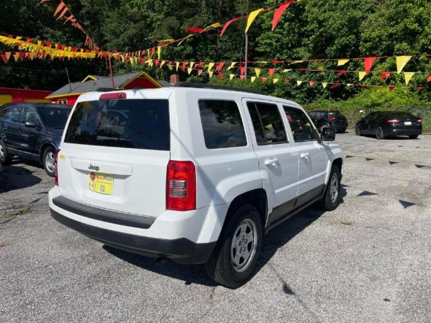 2014 White Jeep Patriot Sport 2WD (1C4NJPBAXED) with an 2.0L L4 DOHC 16V engine, Continuously Variable Transmission transmission, located at 1806 Veterans Memorial Hwy SW, Austell, GA, 30168, (770) 944-9558, 33.817959, -84.606987 - Photo#3