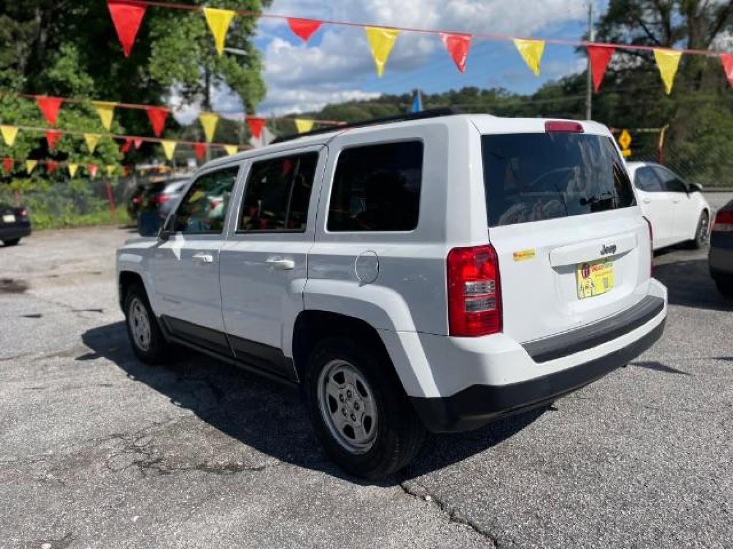 2014 White Jeep Patriot Sport 2WD (1C4NJPBAXED) with an 2.0L L4 DOHC 16V engine, Continuously Variable Transmission transmission, located at 1806 Veterans Memorial Hwy SW, Austell, GA, 30168, (770) 944-9558, 33.817959, -84.606987 - Photo#4