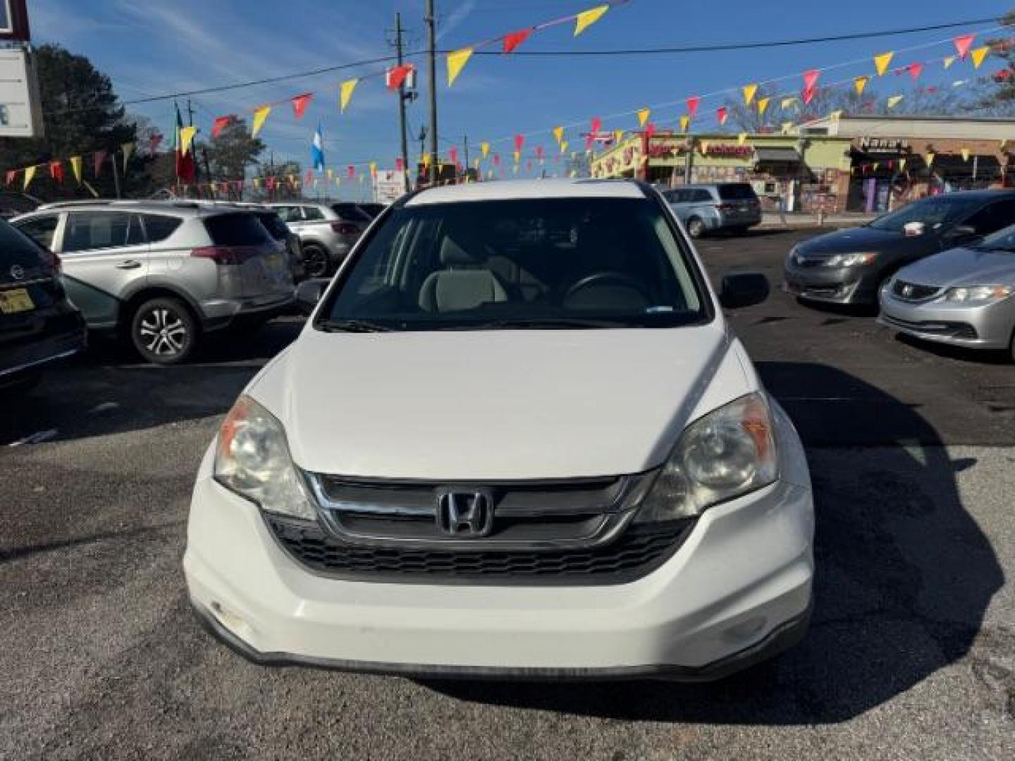 2011 White Honda CR-V SE 2WD 5-Speed AT (5J6RE3H45BL) with an 2.4L L4 DOHC 16V engine, 5-Speed Automatic transmission, located at 1806 Veterans Memorial Hwy SW, Austell, GA, 30168, (770) 944-9558, 33.817959, -84.606987 - Photo#1