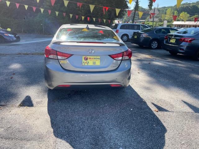 2013 Silver Hyundai Elantra Limited (KMHDH4AE4DU) with an 1.8L L4 DOHC 16V engine, 6-Speed Automatic transmission, located at 1806 Veterans Memorial Hwy SW, Austell, GA, 30168, (770) 944-9558, 33.817959, -84.606987 - Photo#2