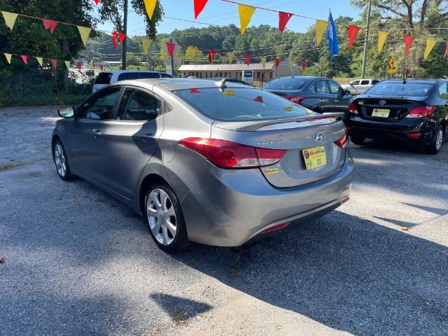 2013 Silver Hyundai Elantra Limited (KMHDH4AE4DU) with an 1.8L L4 DOHC 16V engine, 6-Speed Automatic transmission, located at 1806 Veterans Memorial Hwy SW, Austell, GA, 30168, (770) 944-9558, 33.817959, -84.606987 - Photo#3