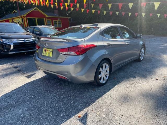 2013 Silver Hyundai Elantra Limited (KMHDH4AE4DU) with an 1.8L L4 DOHC 16V engine, 6-Speed Automatic transmission, located at 1806 Veterans Memorial Hwy SW, Austell, GA, 30168, (770) 944-9558, 33.817959, -84.606987 - Photo#4