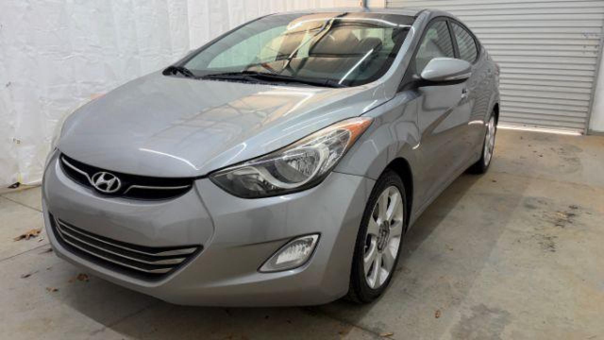2013 Silver Hyundai Elantra Limited (KMHDH4AE4DU) with an 1.8L L4 DOHC 16V engine, 6-Speed Automatic transmission, located at 1806 Veterans Memorial Hwy SW, Austell, GA, 30168, (770) 944-9558, 33.817959, -84.606987 - Photo#0
