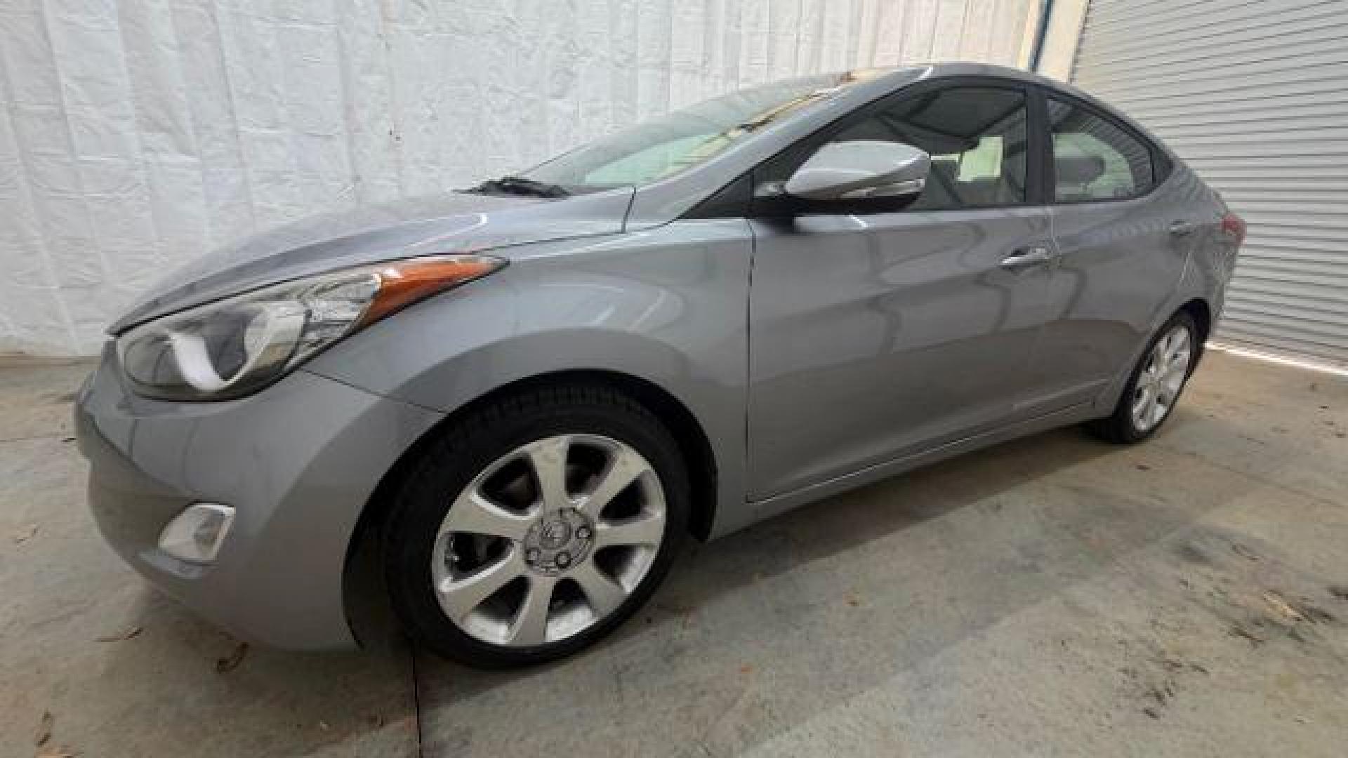 2013 Silver Hyundai Elantra Limited (KMHDH4AE4DU) with an 1.8L L4 DOHC 16V engine, 6-Speed Automatic transmission, located at 1806 Veterans Memorial Hwy SW, Austell, GA, 30168, (770) 944-9558, 33.817959, -84.606987 - Photo#1
