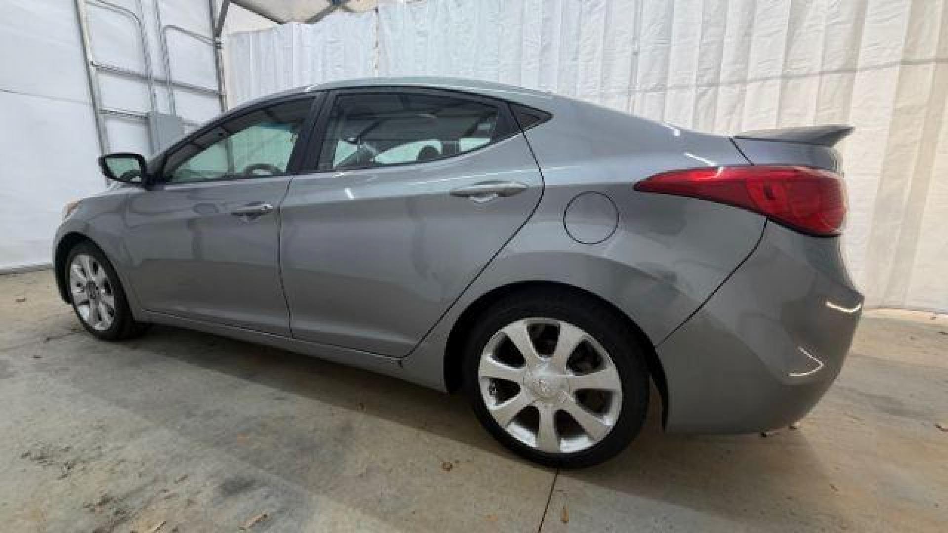 2013 Silver Hyundai Elantra Limited (KMHDH4AE4DU) with an 1.8L L4 DOHC 16V engine, 6-Speed Automatic transmission, located at 1806 Veterans Memorial Hwy SW, Austell, GA, 30168, (770) 944-9558, 33.817959, -84.606987 - Photo#2