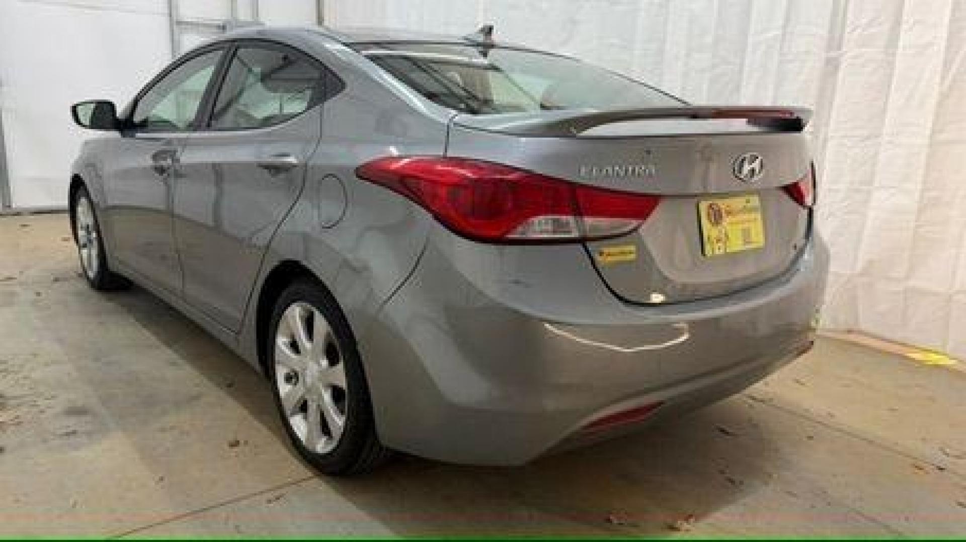2013 Silver Hyundai Elantra Limited (KMHDH4AE4DU) with an 1.8L L4 DOHC 16V engine, 6-Speed Automatic transmission, located at 1806 Veterans Memorial Hwy SW, Austell, GA, 30168, (770) 944-9558, 33.817959, -84.606987 - Photo#3