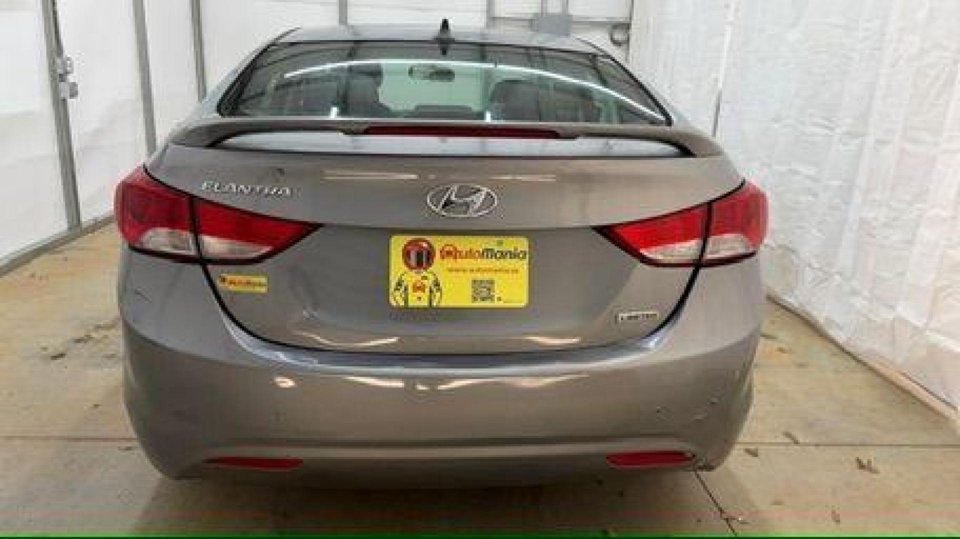 2013 Silver Hyundai Elantra Limited (KMHDH4AE4DU) with an 1.8L L4 DOHC 16V engine, 6-Speed Automatic transmission, located at 1806 Veterans Memorial Hwy SW, Austell, GA, 30168, (770) 944-9558, 33.817959, -84.606987 - Photo#4