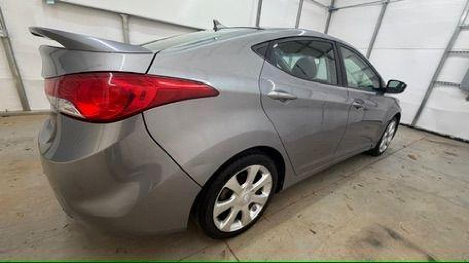 2013 Silver Hyundai Elantra Limited (KMHDH4AE4DU) with an 1.8L L4 DOHC 16V engine, 6-Speed Automatic transmission, located at 1806 Veterans Memorial Hwy SW, Austell, GA, 30168, (770) 944-9558, 33.817959, -84.606987 - Photo#6