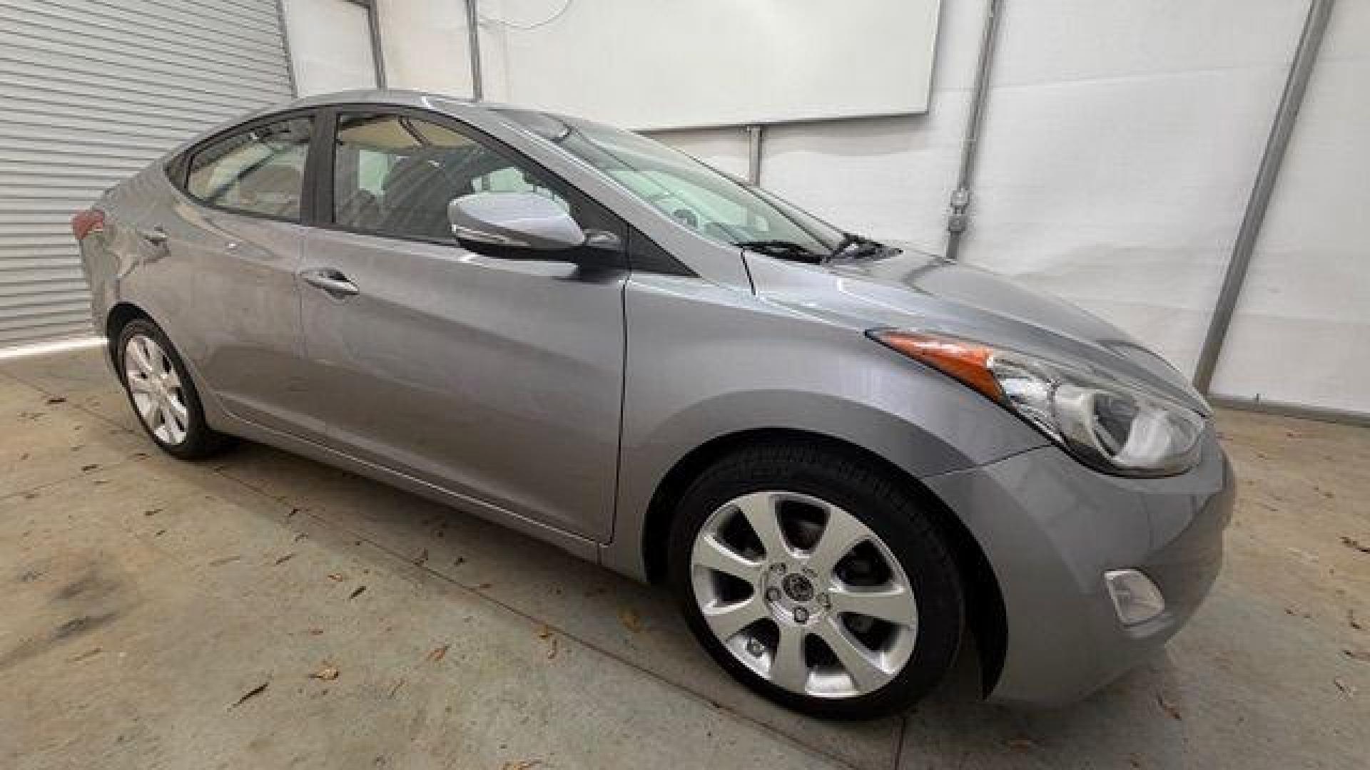 2013 Silver Hyundai Elantra Limited (KMHDH4AE4DU) with an 1.8L L4 DOHC 16V engine, 6-Speed Automatic transmission, located at 1806 Veterans Memorial Hwy SW, Austell, GA, 30168, (770) 944-9558, 33.817959, -84.606987 - Photo#7