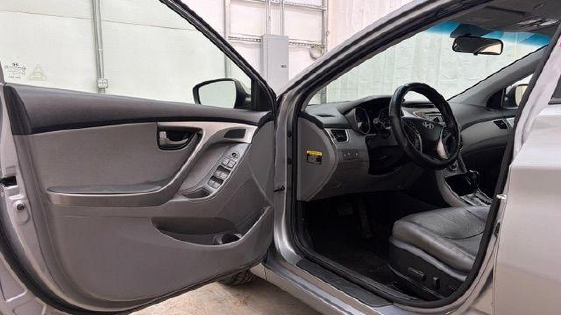 2013 Silver Hyundai Elantra Limited (KMHDH4AE4DU) with an 1.8L L4 DOHC 16V engine, 6-Speed Automatic transmission, located at 1806 Veterans Memorial Hwy SW, Austell, GA, 30168, (770) 944-9558, 33.817959, -84.606987 - Photo#10