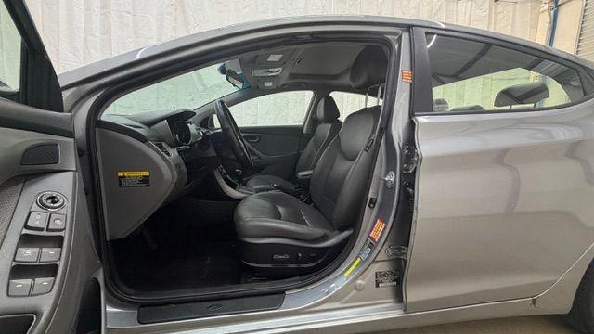 2013 Silver Hyundai Elantra Limited (KMHDH4AE4DU) with an 1.8L L4 DOHC 16V engine, 6-Speed Automatic transmission, located at 1806 Veterans Memorial Hwy SW, Austell, GA, 30168, (770) 944-9558, 33.817959, -84.606987 - Photo#12