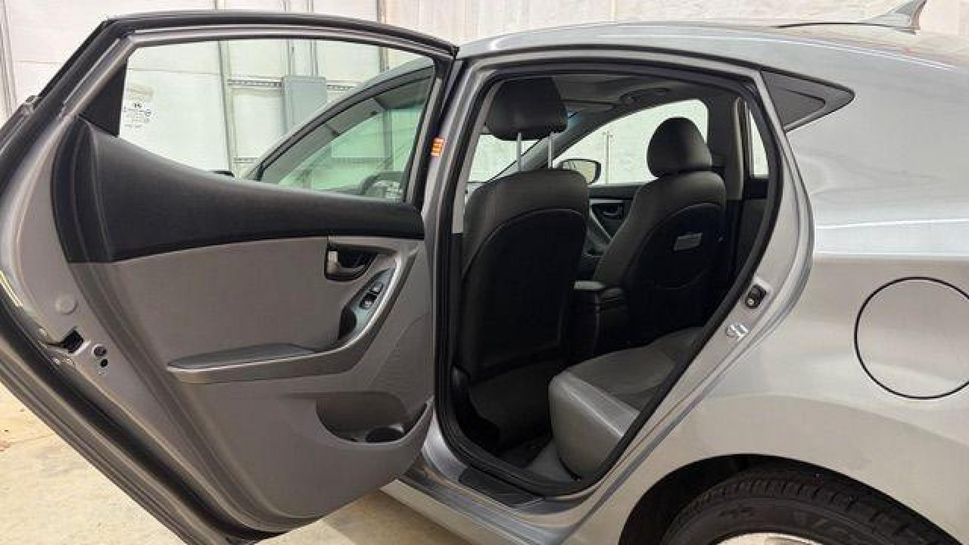 2013 Silver Hyundai Elantra Limited (KMHDH4AE4DU) with an 1.8L L4 DOHC 16V engine, 6-Speed Automatic transmission, located at 1806 Veterans Memorial Hwy SW, Austell, GA, 30168, (770) 944-9558, 33.817959, -84.606987 - Photo#13