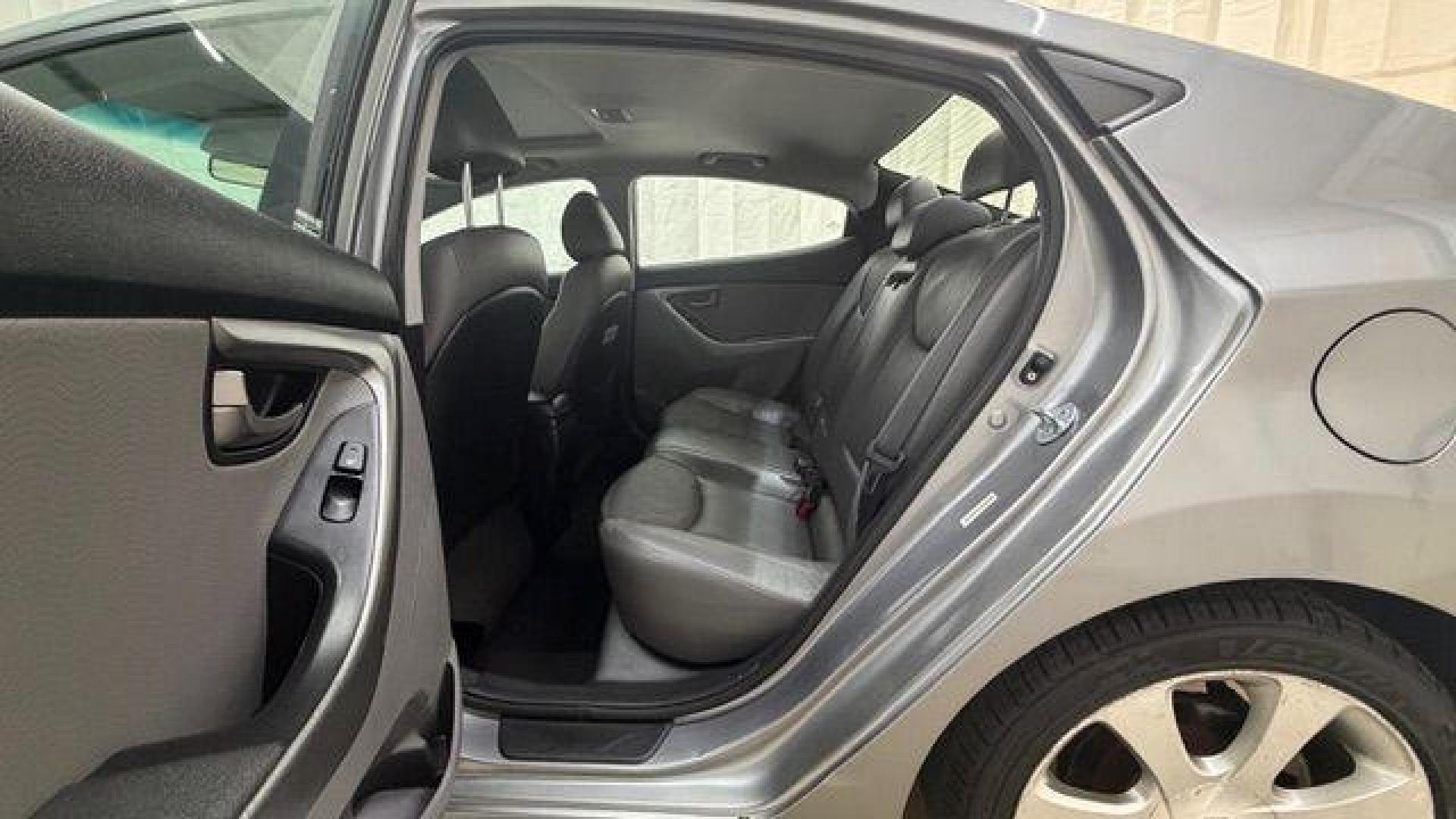 2013 Silver Hyundai Elantra Limited (KMHDH4AE4DU) with an 1.8L L4 DOHC 16V engine, 6-Speed Automatic transmission, located at 1806 Veterans Memorial Hwy SW, Austell, GA, 30168, (770) 944-9558, 33.817959, -84.606987 - Photo#14