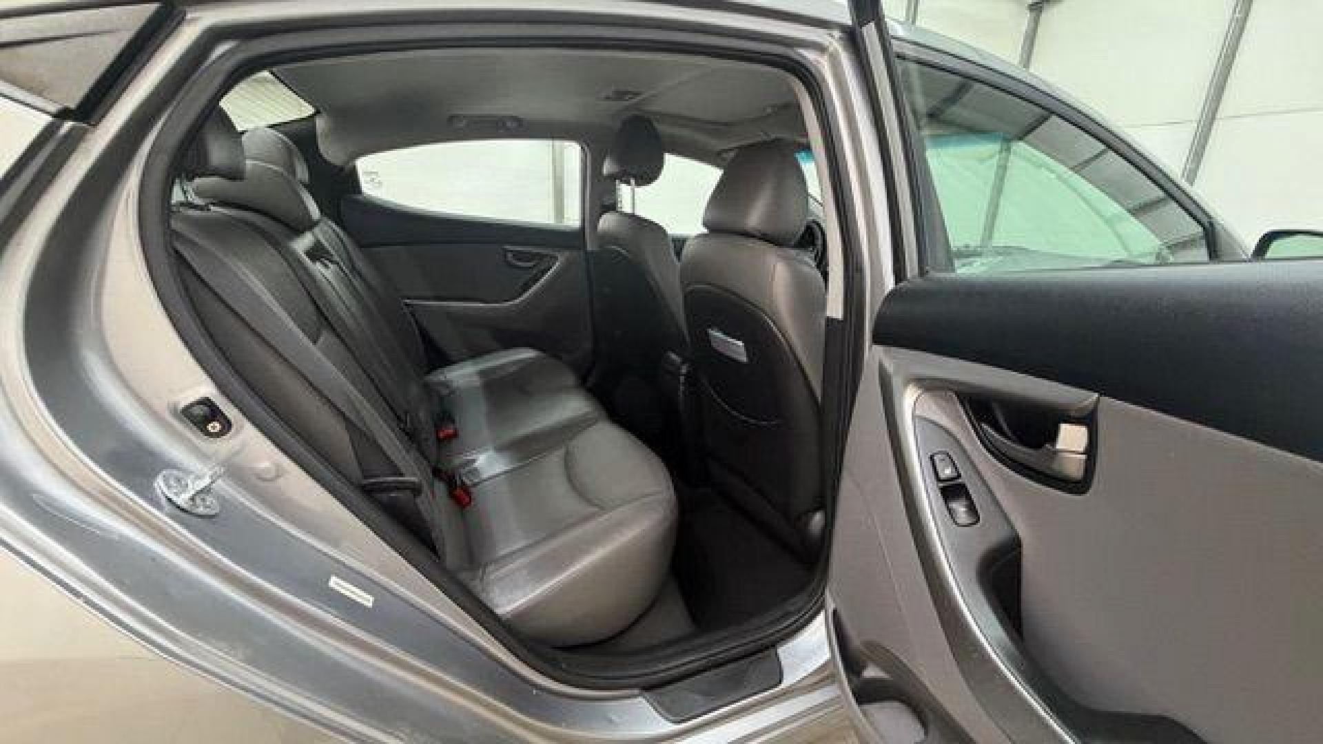 2013 Silver Hyundai Elantra Limited (KMHDH4AE4DU) with an 1.8L L4 DOHC 16V engine, 6-Speed Automatic transmission, located at 1806 Veterans Memorial Hwy SW, Austell, GA, 30168, (770) 944-9558, 33.817959, -84.606987 - Photo#16