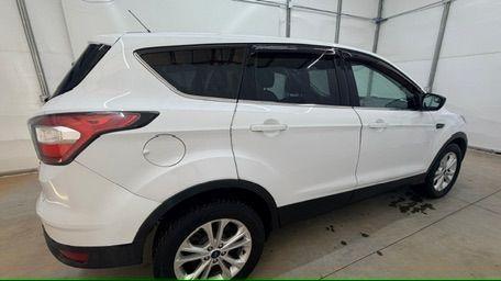2017 White Ford Escape SE FWD (1FMCU0GD2HU) with an 1.5L L4 DOHC 16V engine, 6-Speed Automatic transmission, located at 1806 Veterans Memorial Hwy SW, Austell, GA, 30168, (770) 944-9558, 33.817959, -84.606987 - Photo#6
