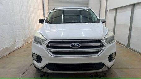 2017 White Ford Escape SE FWD (1FMCU0GD2HU) with an 1.5L L4 DOHC 16V engine, 6-Speed Automatic transmission, located at 1806 Veterans Memorial Hwy SW, Austell, GA, 30168, (770) 944-9558, 33.817959, -84.606987 - Photo#9