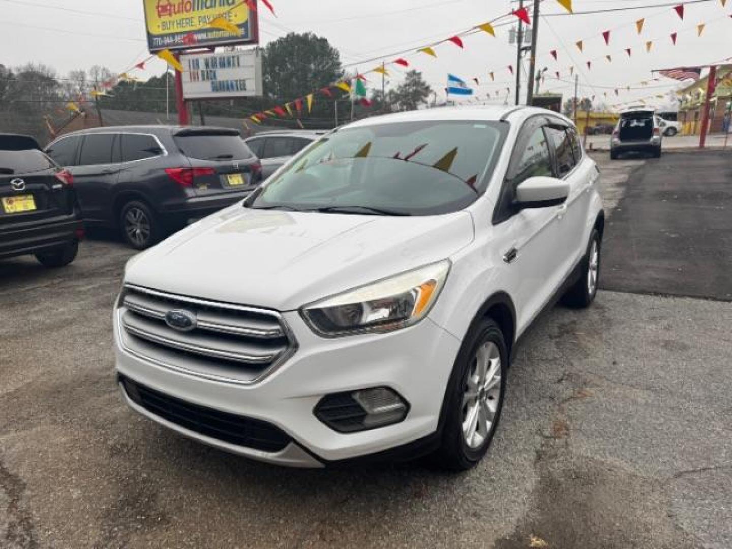 2017 White Ford Escape SE FWD (1FMCU0GD2HU) with an 1.5L L4 DOHC 16V engine, 6-Speed Automatic transmission, located at 1806 Veterans Memorial Hwy SW, Austell, GA, 30168, (770) 944-9558, 33.817959, -84.606987 - Photo#0