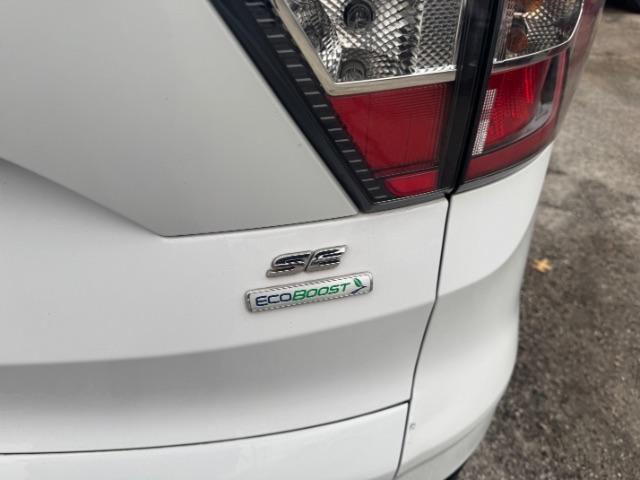 2017 White Ford Escape SE FWD (1FMCU0GD2HU) with an 1.5L L4 DOHC 16V engine, 6-Speed Automatic transmission, located at 1806 Veterans Memorial Hwy SW, Austell, GA, 30168, (770) 944-9558, 33.817959, -84.606987 - Photo#14