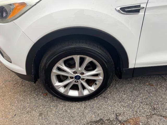 2017 White Ford Escape SE FWD (1FMCU0GD2HU) with an 1.5L L4 DOHC 16V engine, 6-Speed Automatic transmission, located at 1806 Veterans Memorial Hwy SW, Austell, GA, 30168, (770) 944-9558, 33.817959, -84.606987 - Photo#18