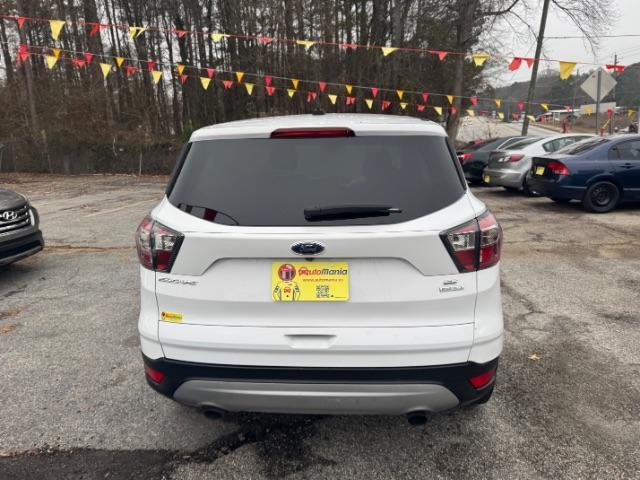 2017 White Ford Escape SE FWD (1FMCU0GD2HU) with an 1.5L L4 DOHC 16V engine, 6-Speed Automatic transmission, located at 1806 Veterans Memorial Hwy SW, Austell, GA, 30168, (770) 944-9558, 33.817959, -84.606987 - Photo#3