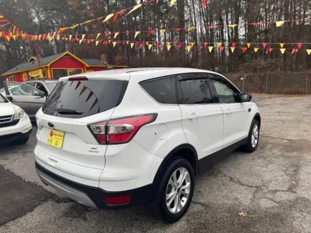 2017 White Ford Escape SE FWD (1FMCU0GD2HU) with an 1.5L L4 DOHC 16V engine, 6-Speed Automatic transmission, located at 1806 Veterans Memorial Hwy SW, Austell, GA, 30168, (770) 944-9558, 33.817959, -84.606987 - Photo#4